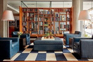 image of the living room with book shelves at the study at yale hotel