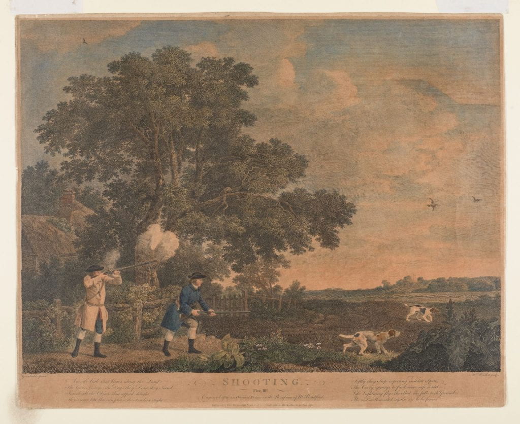 Two men hunt in the field across from a thatched cottage